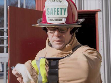 image of fireman using hands free comm device